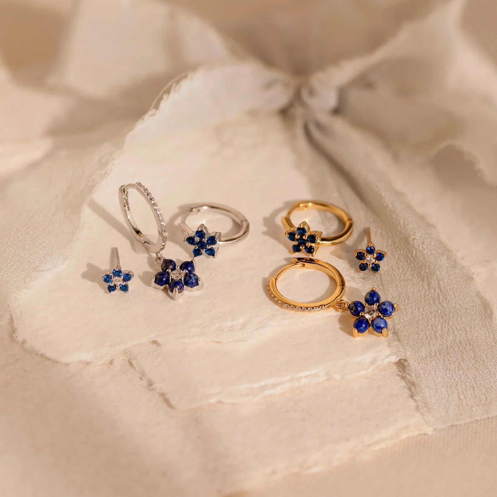 Blue sapphire petal earrings with elegant floral design